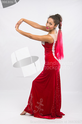 Image of Girl dancer performs a dance elements