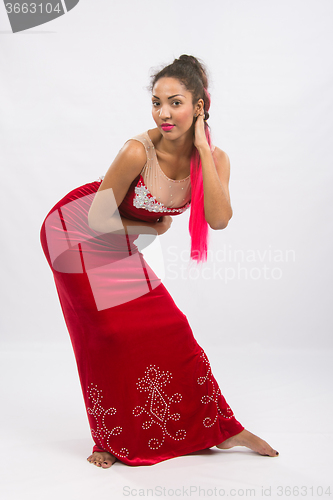 Image of Girl dancer performs a dance elements