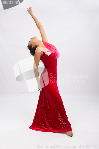 Image of Girl dancer performs a dance elements