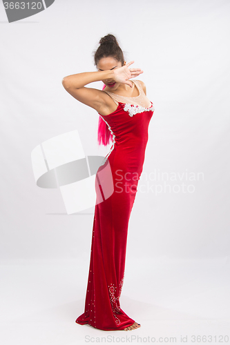 Image of Girl dancer performs a dance elements