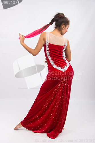 Image of Girl dancer performs a dance elements