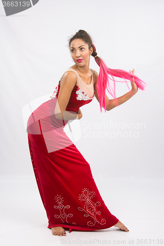 Image of Girl dancer performs a dance elements