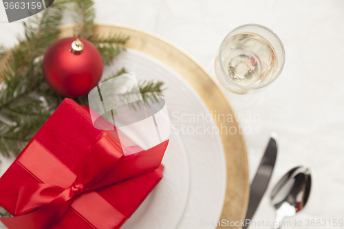 Image of Christmas Gift with Place Setting at Table