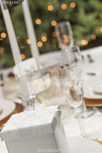 Image of Christmas Gift with Place Setting at Table