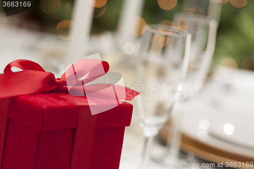 Image of Christmas Gift with Place Setting at Table