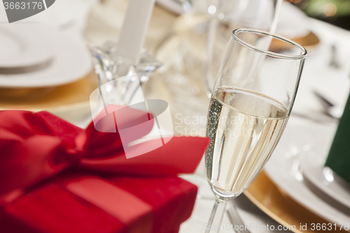 Image of Christmas Gift with Place Setting at Table