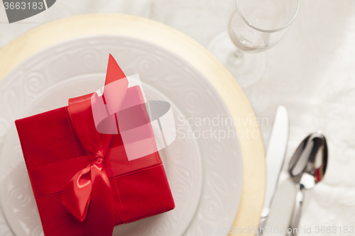 Image of Christmas Gift with Place Setting at Table