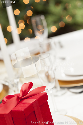 Image of Christmas Gift with Place Setting at Table