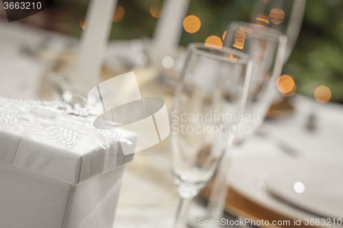 Image of Christmas Gift with Place Setting at Table