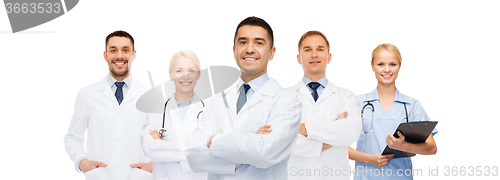 Image of group of smiling doctors with clipboard