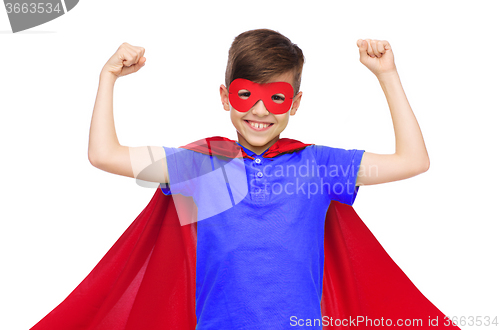 Image of boy in red super hero cape and mask showing fists