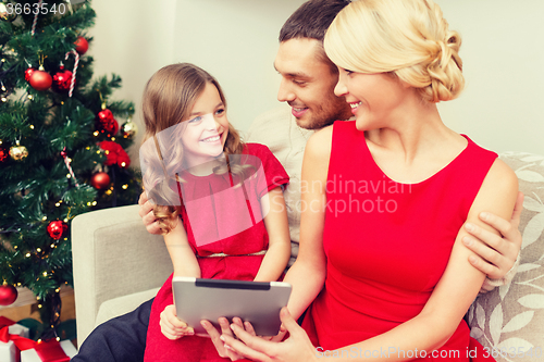 Image of smiling family with tablet pc