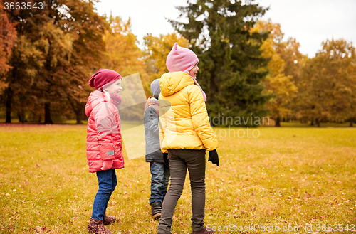 Image of group of happy children in autumn park
