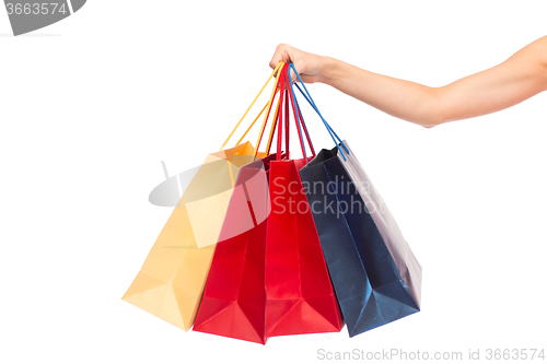 Image of close up of female hand holding shopping bags