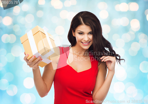 Image of beautiful sexy woman in red dress with gift box