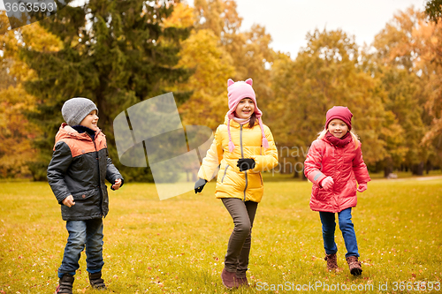 Image of group of happy little kids running outdoors