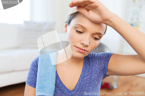 Image of close up of tired woman after workout at home
