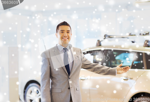 Image of happy man at auto show or car salon