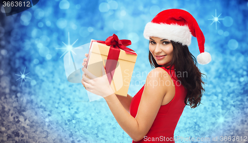 Image of beautiful sexy woman in santa hat with gift box