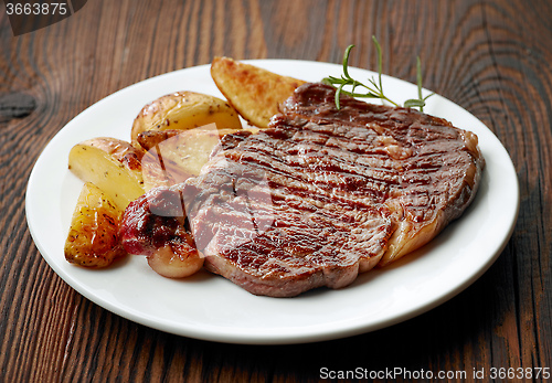 Image of grilled beef steak and potatoes