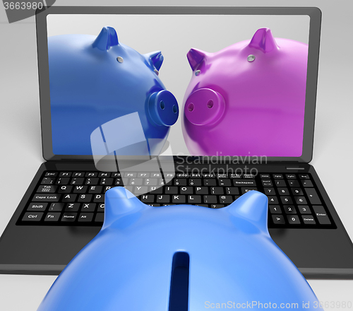 Image of Piggybanks On Notebook Showing Online Transactions