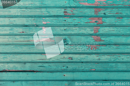 Image of old wooden boards painted in blue background