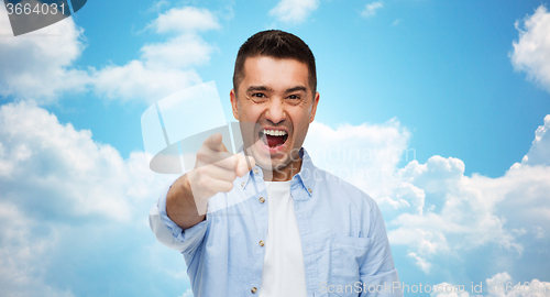 Image of angry man shouting and pointing finger on you