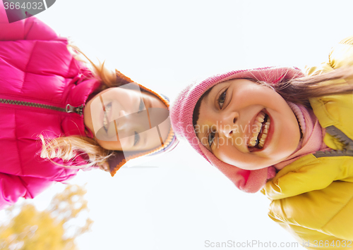 Image of happy girls faces outdoors
