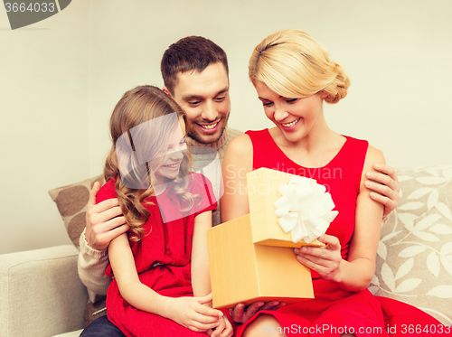 Image of happy family opening gift box