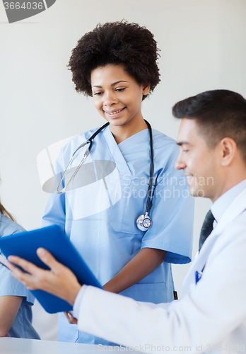 Image of happy doctors meeting at hospital office