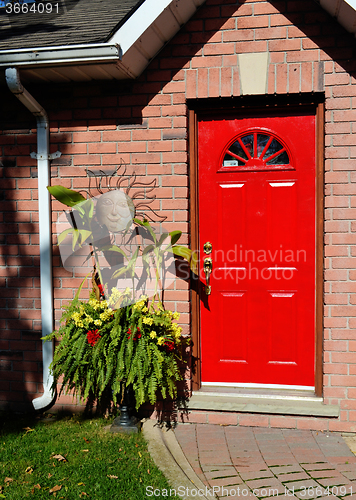 Image of Red entrance door of a house.