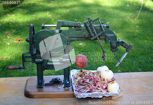 Image of An antique apple peeler.