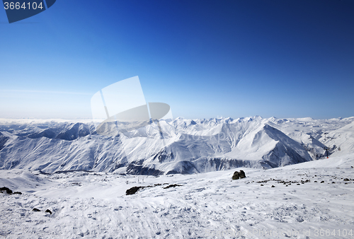 Image of Snowy mountains at nice sun day