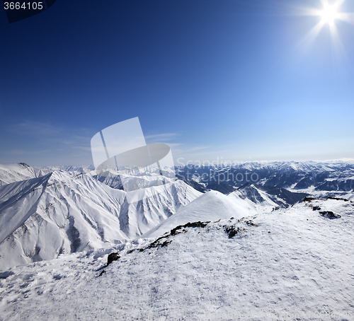 Image of Snowy mountains at nice sun day