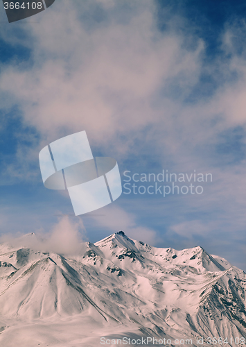 Image of Toned landscape of winter mountains at windy day