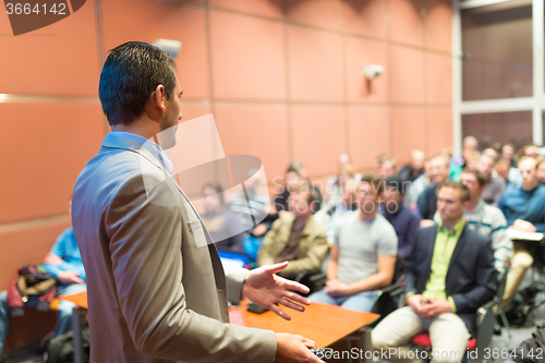 Image of Speaker at Business Conference and Presentation.