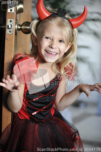 Image of Little girl in Halloween costume.