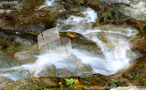 Image of Beautiful waterfall in mountains 