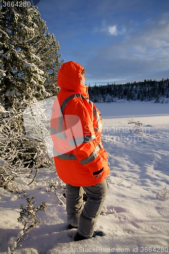 Image of Woman in rescue crew jacket