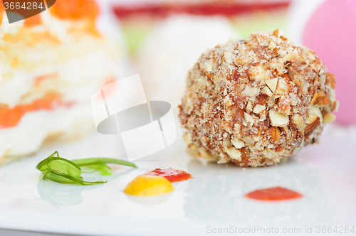 Image of Unusiual nut ball with salmon sauce