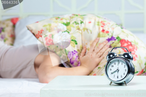 Image of The young girl sleeping in bed
