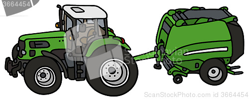 Image of Tractor with a hay binder