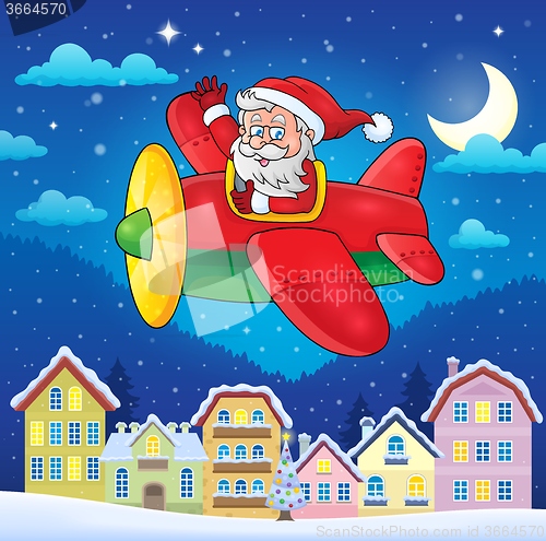 Image of Christmas town with Santa Claus in plane