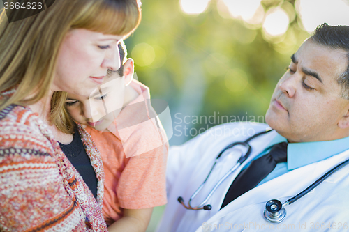 Image of Sick Mixed Race Boy, Mother and Hispanic Doctor Outdoors