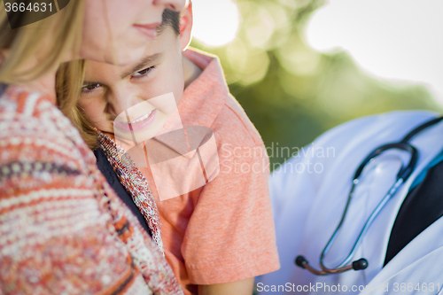 Image of Sick Mixed Race Boy, Mother and Hispanic Doctor Outdoors