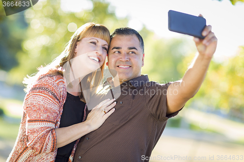 Image of Attractive Mixed Race Couple Taking Self Portraits