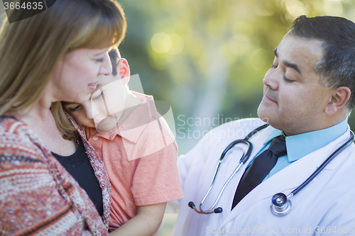 Image of Sick Mixed Race Boy, Mother and Hispanic Doctor Outdoors