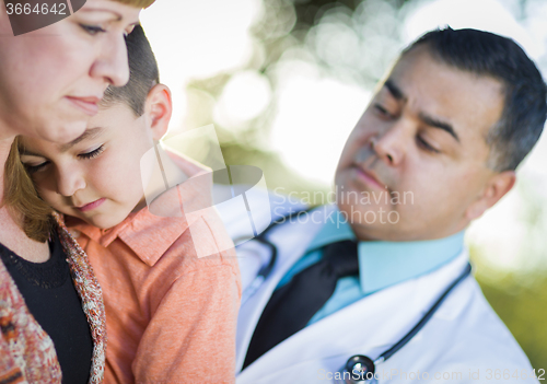 Image of Sick Mixed Race Boy, Mother and Hispanic Doctor Outdoors