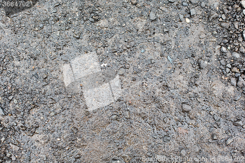 Image of close up of wet gray gravel road or ground