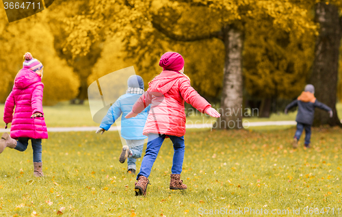 Image of group of happy little kids running outdoors